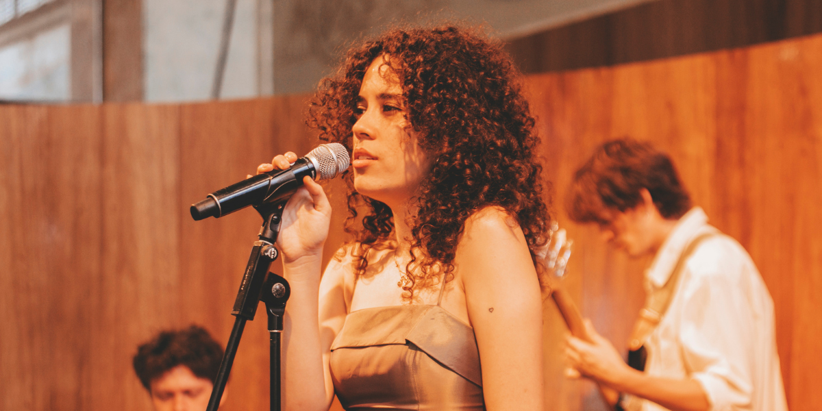 Close-up of Mina-Siale performing at the Long Summer Lunch
