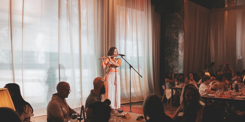 Little Green playing the flute at Long Summer Lunch