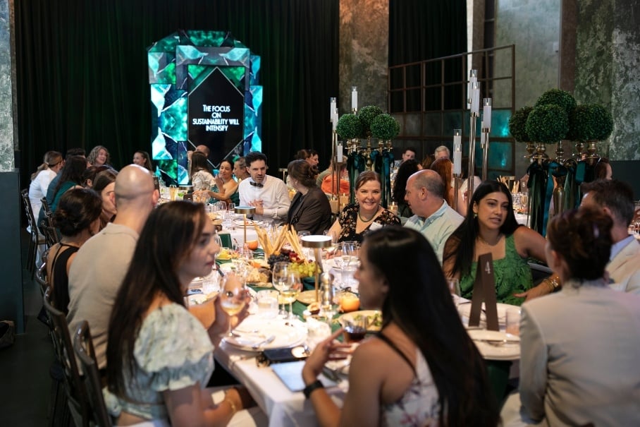 Emerald screen installation and guests at tables