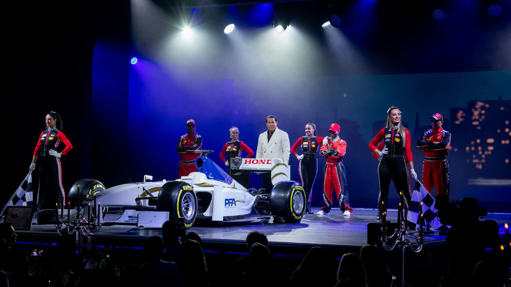 Revealing a Formula 1 car on stage surrounded by dancers