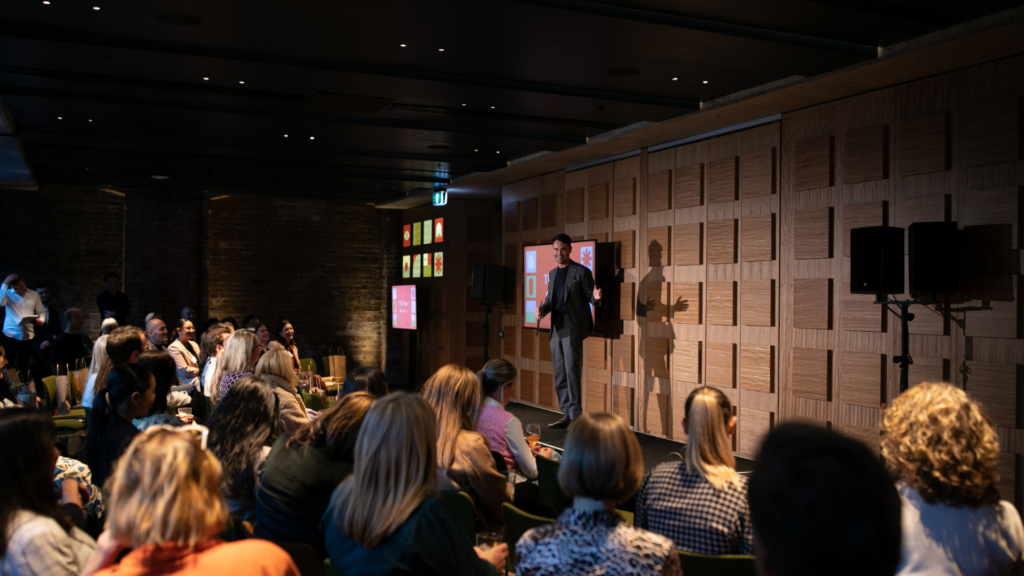 Presenter Nick Bartlett on stage at The Mixer, an AV1, Ace Hotel and Inspire Speakers event for event planners | Credit Oneil Photographics
