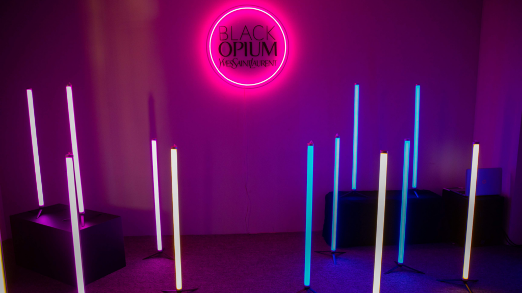 Coloured upright lighting tubes and neon Yves Saint Laurent Logo