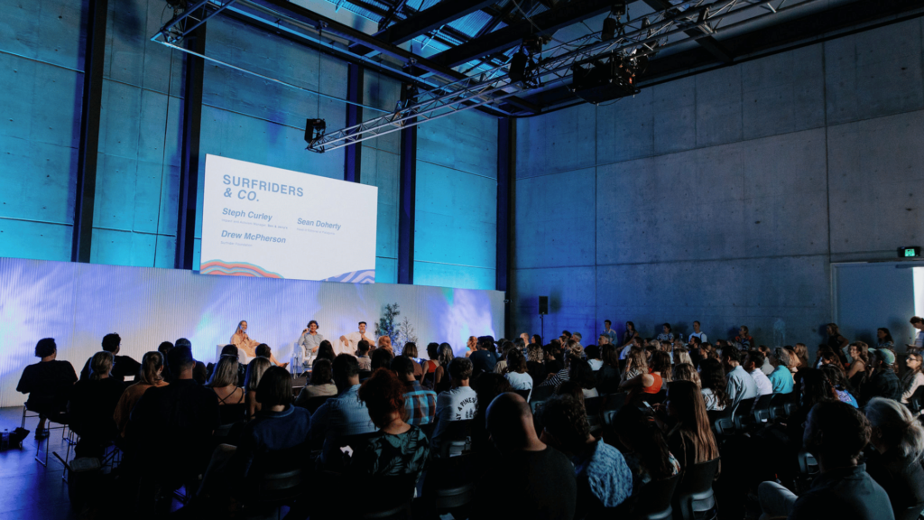 Themed stage lighting, wall wash and projection for Purpose Conference 2023 at Carriageworks